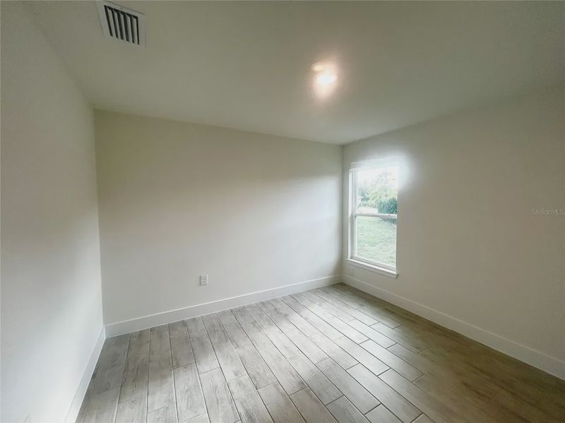 Spacious, unfurnished interior of a new home in Deep Creek, Punta Gorda (Image 24).