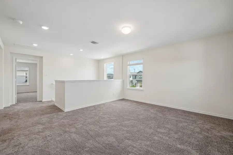 Spacious, unfurnished interior of a new home in Preserve at Culebra - Sterling Collection, San Antonio (Image 24).