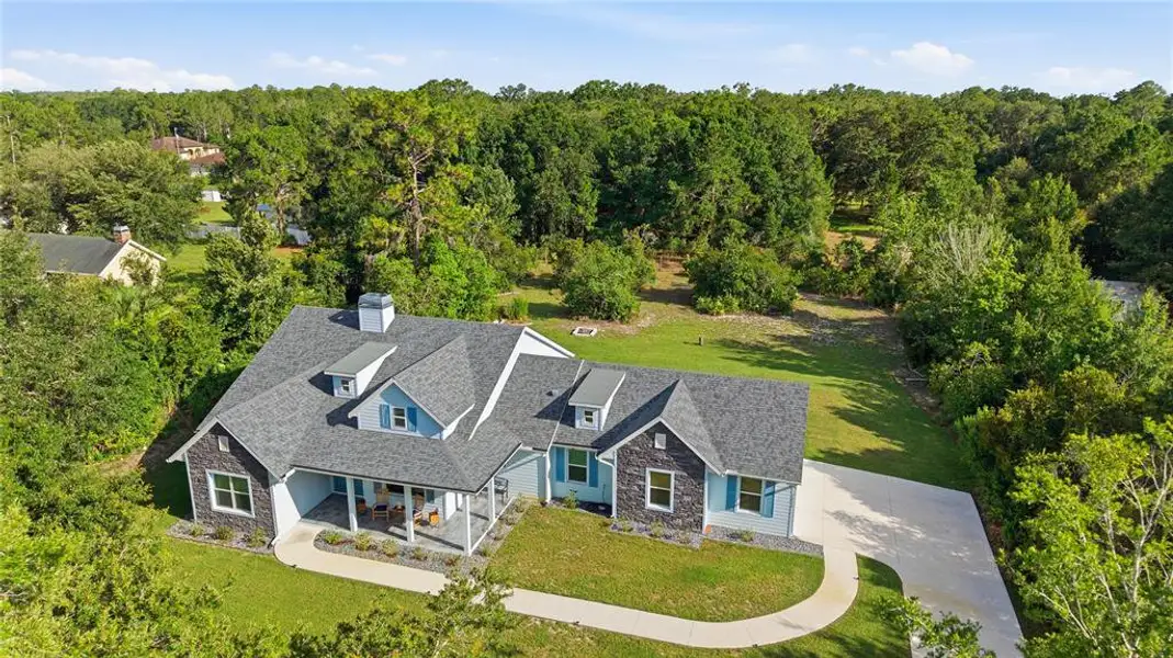 Front exterior of a new home in , Wesley Chapel, FL, highlighting curb appeal (Image 2). Front exterior of a new home in , Wesley Chapel, FL, highlighting curb appeal (Image 2).