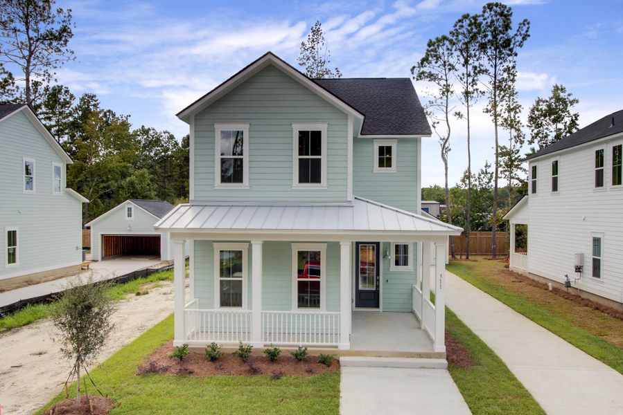 Front exterior of a new home in Heron's Walk at Summers Corner: Row Collection, Summerville, SC, highlighting curb appeal (Image 1).