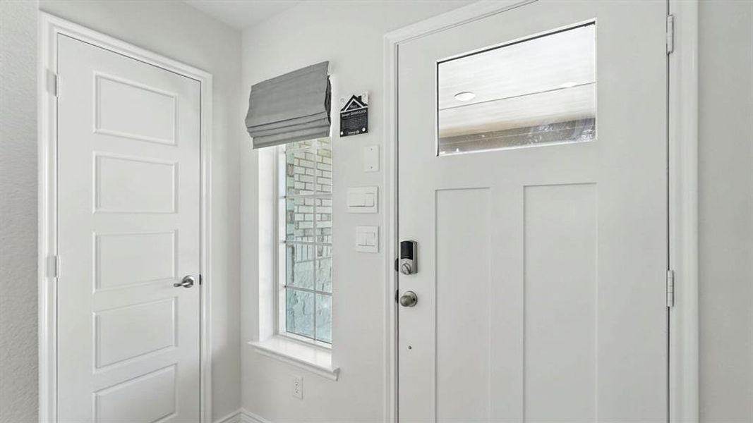 Entrance foyer featuring baseboards