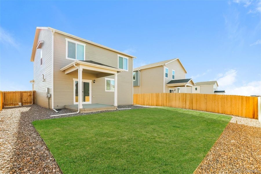Exterior details and patio area of a home in Second Creek Farm, Commerce City (Image 3).