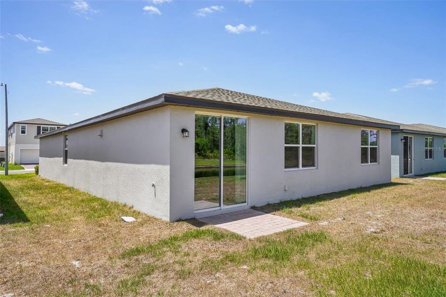 Front exterior of a new home in Lake Deer Estates - Signature Series, Poinciana, FL, highlighting curb appeal (Image 23). Front exterior of a new home in Lake Deer Estates - Signature Series, Poinciana, FL, highlighting curb appeal (Image 23).