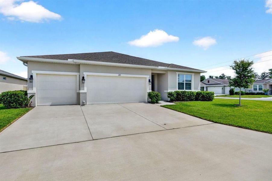 Front exterior of a new home in Archers Mill, Ormond Beach, FL, highlighting curb appeal (Image 27).