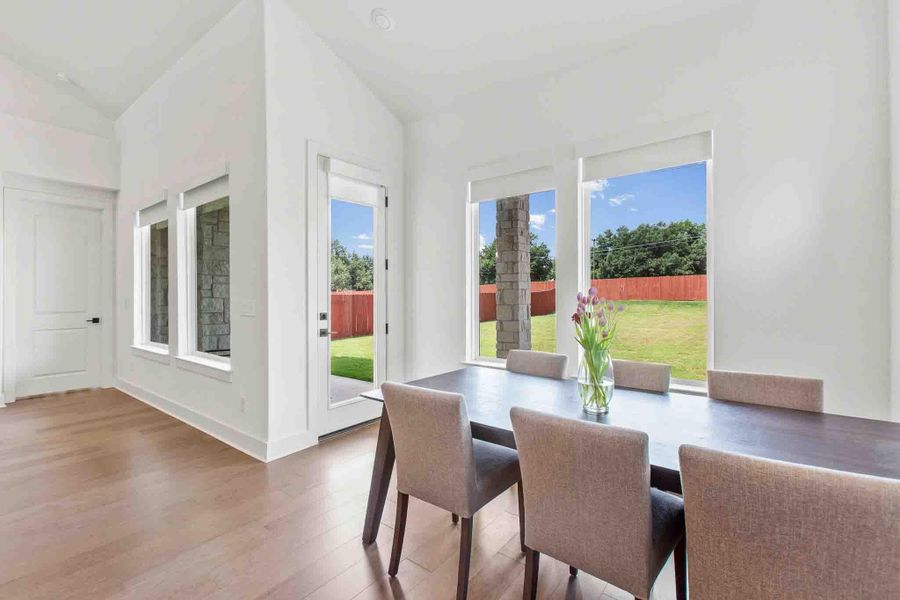 Bright interior featuring wood-finish flooring and white walls