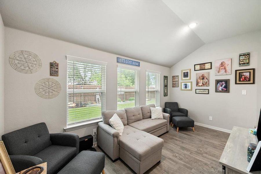 Extra space off of the living room that could be an office or workout space or kids play room