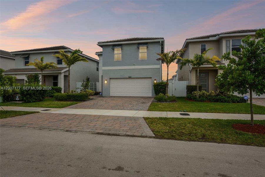Front exterior of a new home in Messina Place, Homestead, FL, highlighting curb appeal (Image 23).