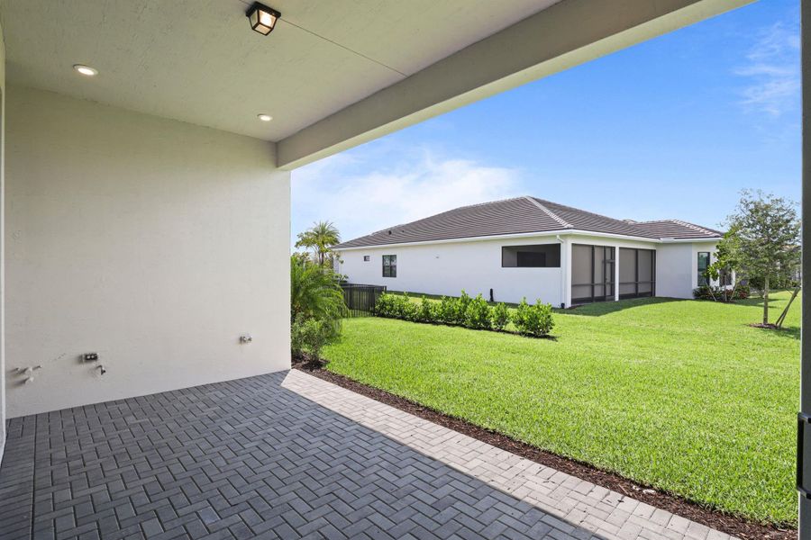 Exterior details and patio area of a home in Cresswind Palm Beach at Westlake, The Acreage (Image 34).