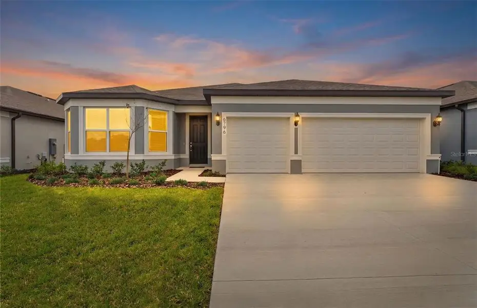 Front exterior of a new home in Pioneer Ranch, Ocala, FL, highlighting curb appeal (Image 2). Front exterior of a new home in Pioneer Ranch, Ocala, FL, highlighting curb appeal (Image 2).