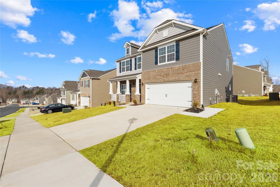 Front exterior of a new home in Adair Woods, Davidson, NC, highlighting curb appeal (Image 29). Front exterior of a new home in Adair Woods, Davidson, NC, highlighting curb appeal (Image 29).