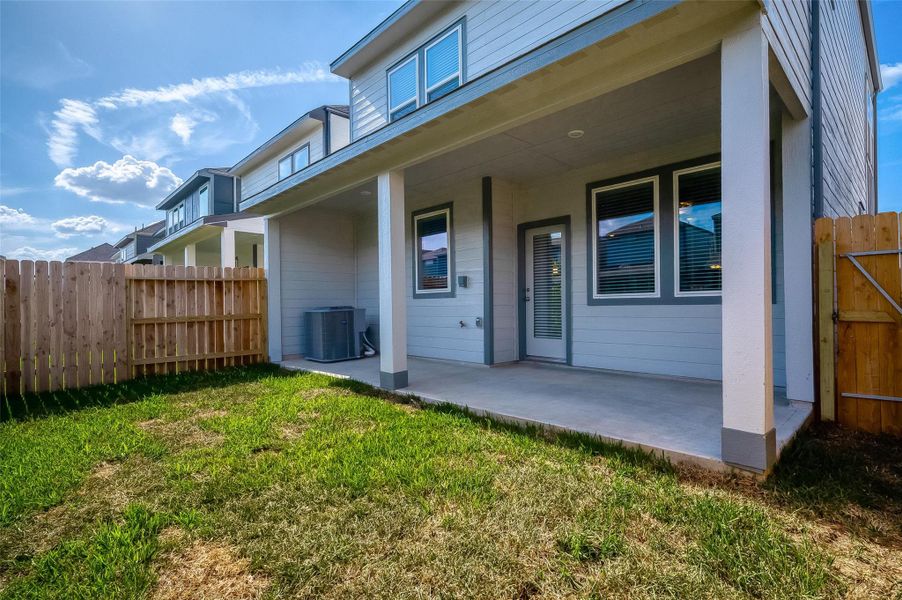 Front exterior of a new home in McClendon Park Village, Houston, TX, highlighting curb appeal (Image 24). Front exterior of a new home in McClendon Park Village, Houston, TX, highlighting curb appeal (Image 24).
