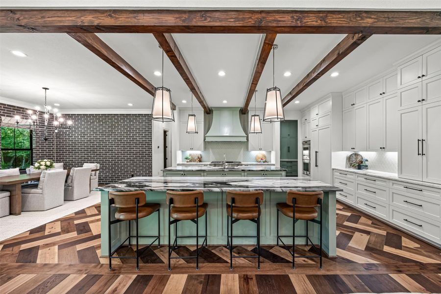 Gorgeous chef’s kitchen with a bold designer island and plenty of cabinet space Gorgeous chef’s kitchen with a bold designer island and plenty of cabinet space