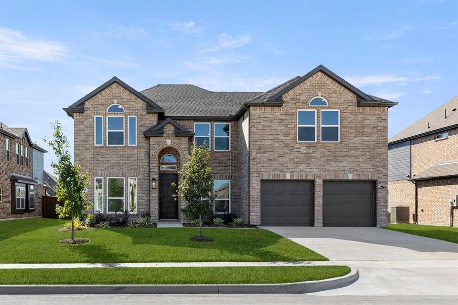 Front exterior of a new home in Grayhawk Addition, Forney, TX, highlighting curb appeal (Image 1). Front exterior of a new home in Grayhawk Addition, Forney, TX, highlighting curb appeal (Image 1).