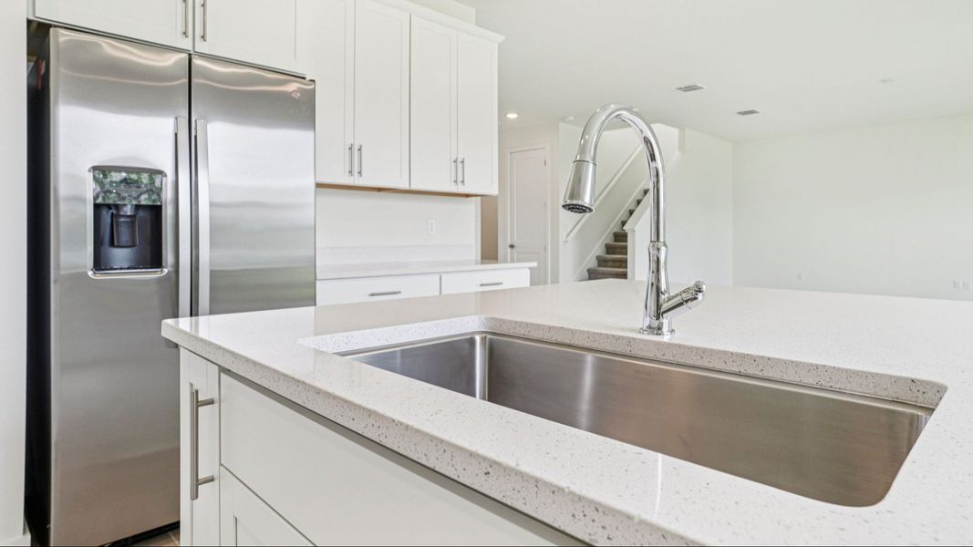Plumeria Floor Plan featuring a bright kitchen with large island by DRB Homes in Trailside located in Mount Dora, FL Plumeria Floor Plan featuring a bright kitchen with large island by DRB Homes in Trailside located in Mount Dora, FL