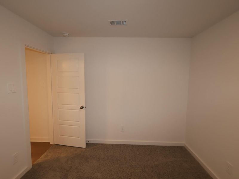 Spacious, unfurnished interior of a new home in Pinewood at Grand Texas, New Caney (Image 8).