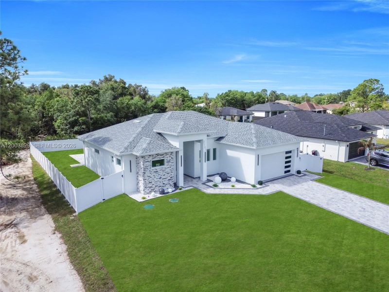 Front exterior of a new home in , Lehigh Acres, FL, highlighting curb appeal (Image 2). Front exterior of a new home in , Lehigh Acres, FL, highlighting curb appeal (Image 2).