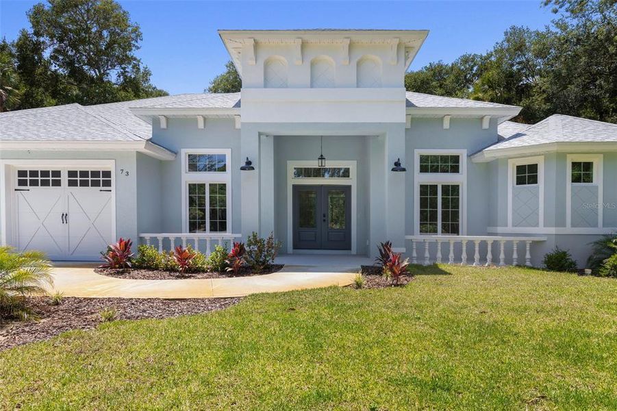 Front exterior of a new home in , Flagler Beach, FL, highlighting curb appeal (Image 1). Front exterior of a new home in , Flagler Beach, FL, highlighting curb appeal (Image 1).