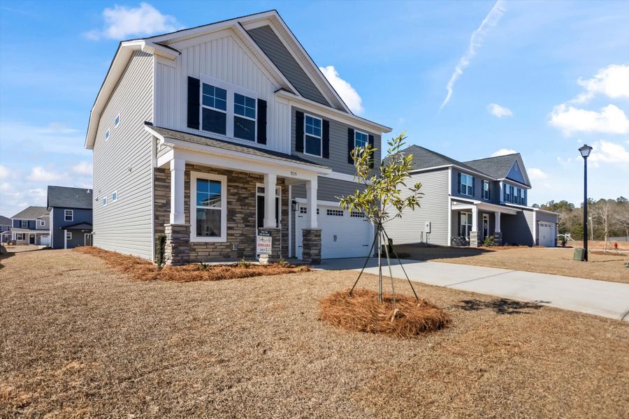 Front exterior of a new home in Portrait Hills, Aiken, SC, highlighting curb appeal (Image 2). Front exterior of a new home in Portrait Hills, Aiken, SC, highlighting curb appeal (Image 2).