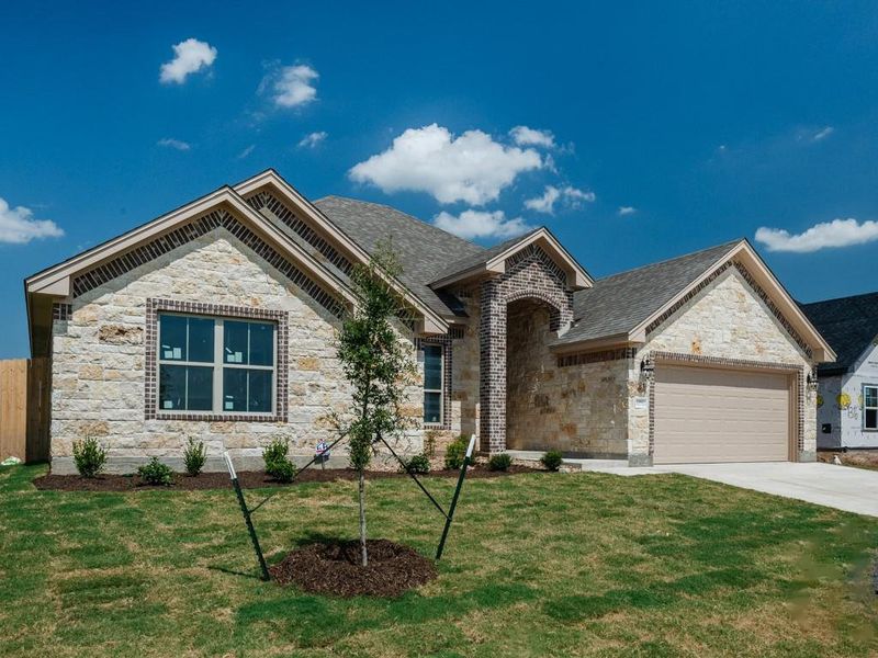 View of front of house with stone siding, a garage, concrete driveway, and roof with shingles View of front of house with stone siding, a garage, concrete driveway, and roof with shingles