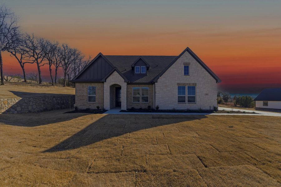 Front exterior of a new home in Oak Grove Addition, Springtown, TX, highlighting curb appeal (Image 2). Front exterior of a new home in Oak Grove Addition, Springtown, TX, highlighting curb appeal (Image 2).