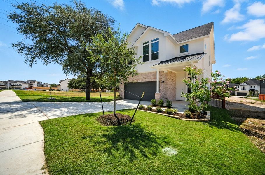 Front exterior of a new home in Foxfield, Austin, TX, highlighting curb appeal (Image 2). Front exterior of a new home in Foxfield, Austin, TX, highlighting curb appeal (Image 2).