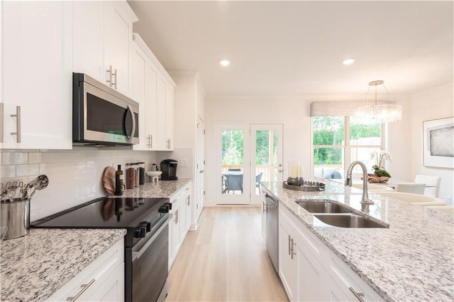 Furnished interior view inside a new home in Towns at Enclave, Lawrenceville (Image 4). Furnished interior view inside a new home in Towns at Enclave, Lawrenceville (Image 4).