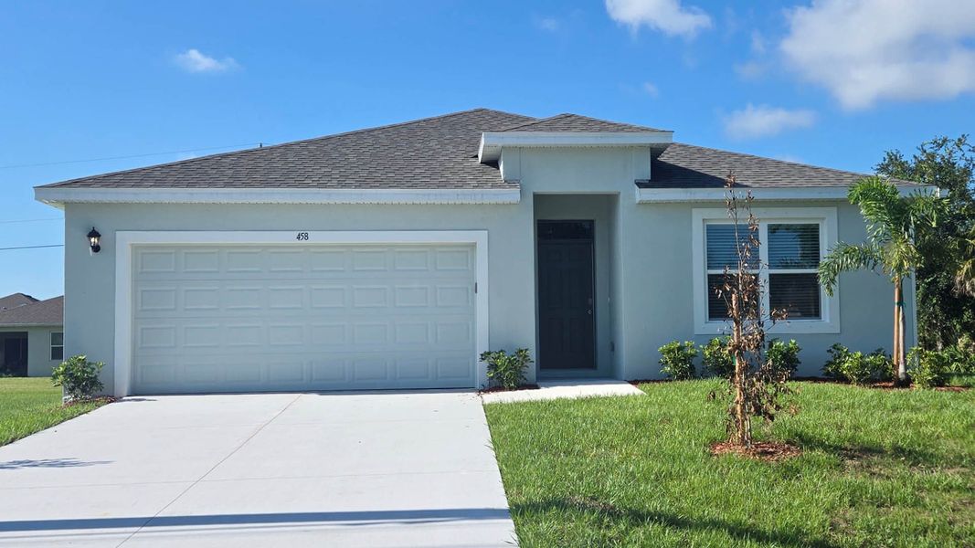 Front exterior of a new home in Palm Bay, Palm Bay, FL, highlighting curb appeal (Image 1). Front exterior of a new home in Palm Bay, Palm Bay, FL, highlighting curb appeal (Image 1).