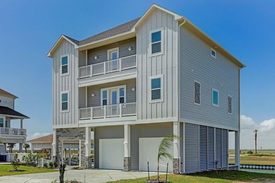 Easy maintenance Hardie siding & louvered garage area. Easy maintenance Hardie siding & louvered garage area.
