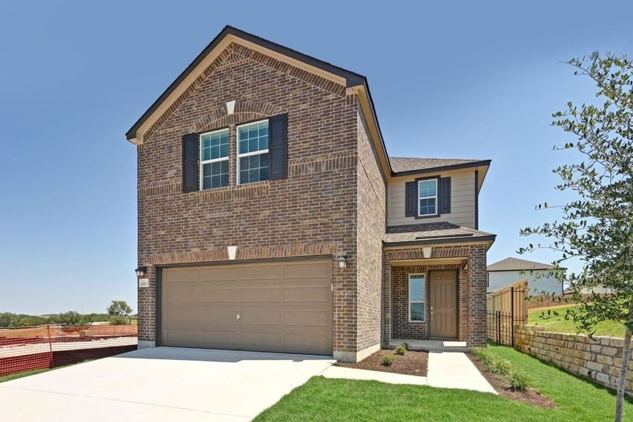 Front exterior of a new home in Creekside at Estancia, Austin, TX, highlighting curb appeal (Image 1). Front exterior of a new home in Creekside at Estancia, Austin, TX, highlighting curb appeal (Image 1).