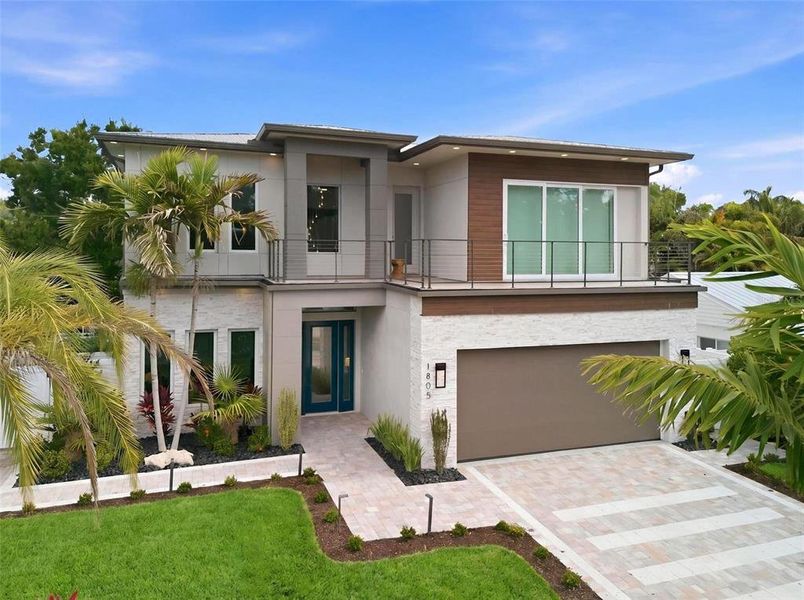 Front exterior of a new home in , Sarasota, FL, highlighting curb appeal (Image 28).