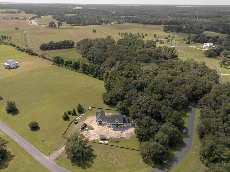 Front exterior of a new home in , Wadmalaw Island, SC, highlighting curb appeal (Image 6). Front exterior of a new home in , Wadmalaw Island, SC, highlighting curb appeal (Image 6).
