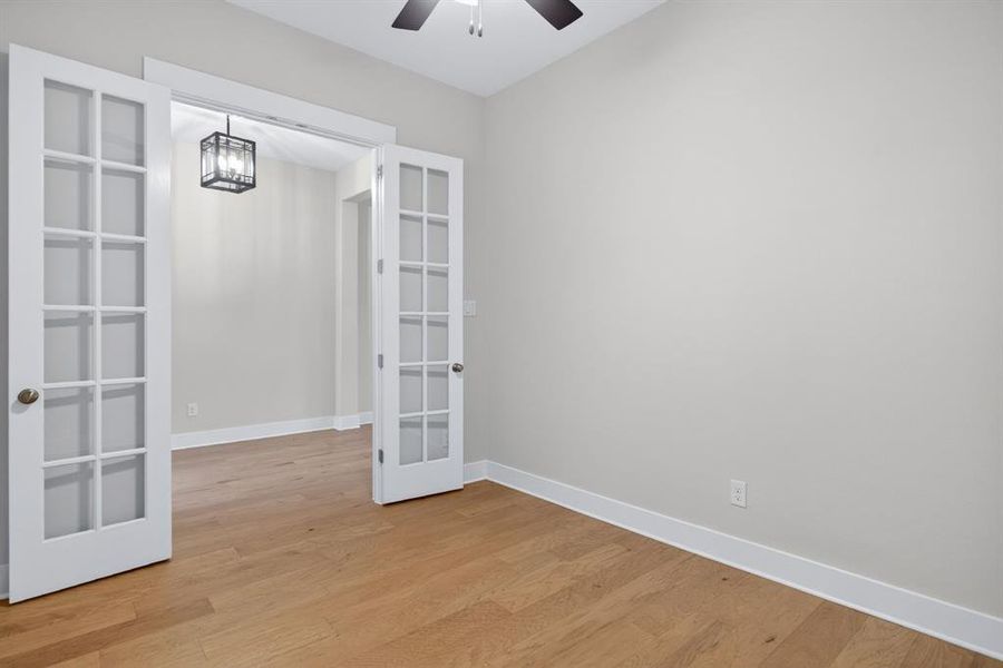 Room featuring light wood-finish flooring and neutral wall tones Room featuring light wood-finish flooring and neutral wall tones