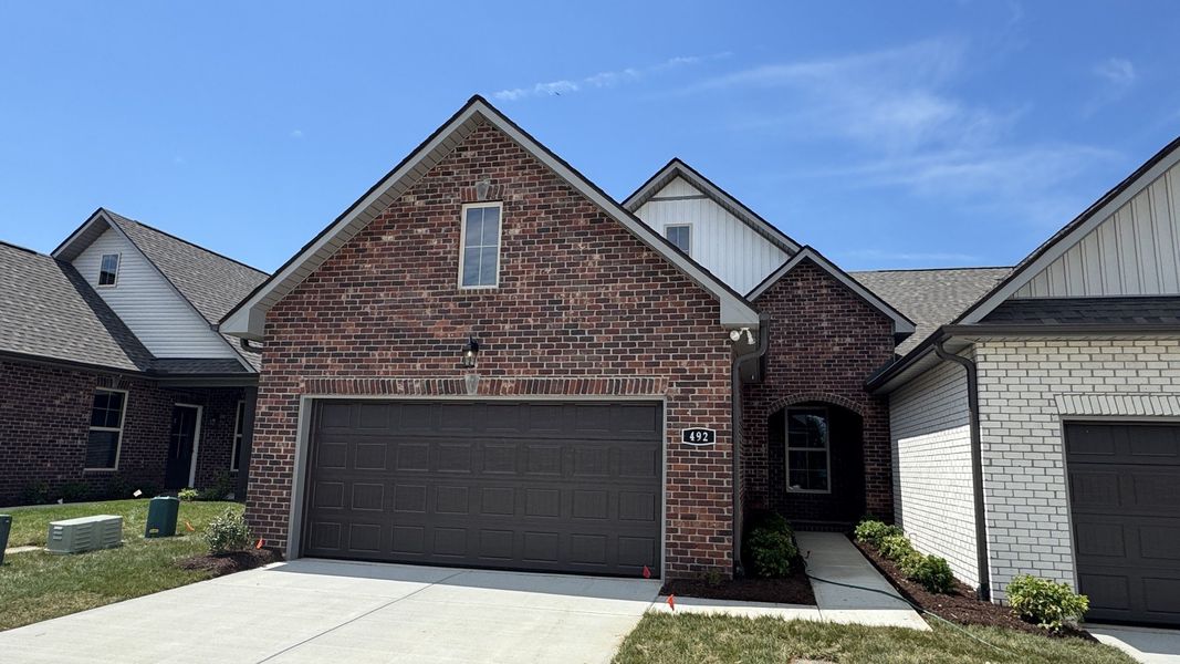 Front exterior of a new home in The Greens at Legacy Townhomes, Springfield, TN, highlighting curb appeal (Image 18).