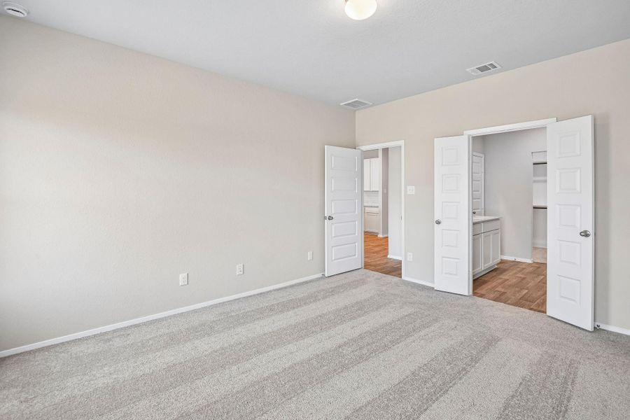 The spacious layout offers plenty of room for a plush king-sized bed, adorned with fluffy pillows and your favorite throws, inviting you to sink in and relax.