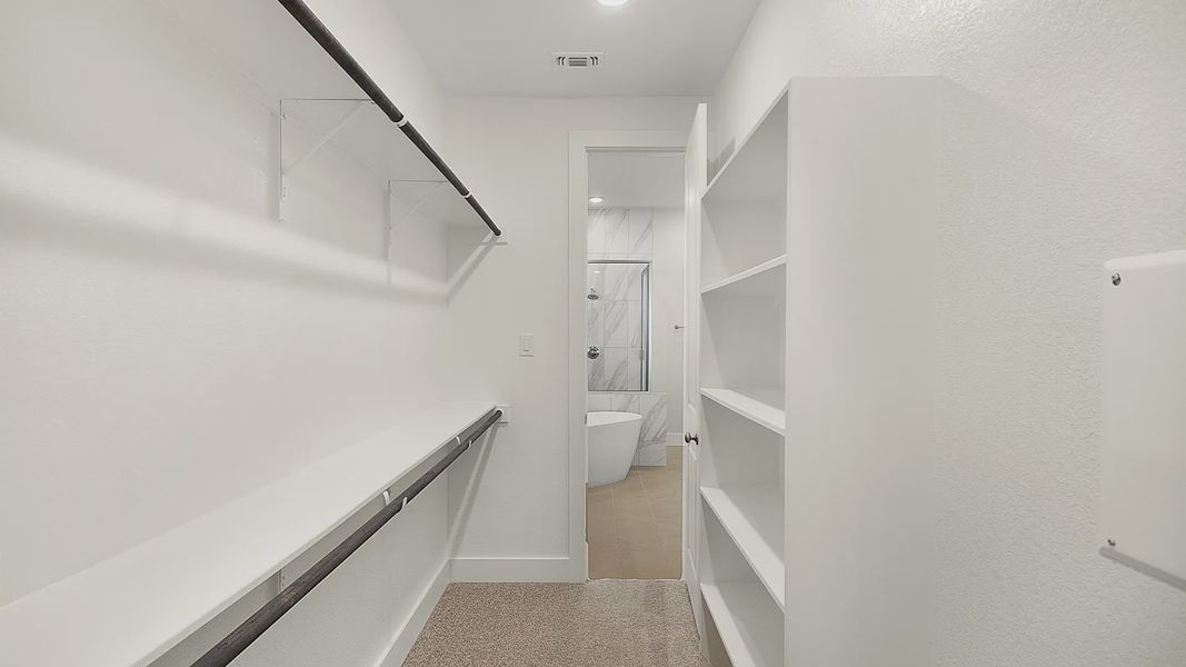 Representative furnished interior of a home built from the Brenner by Chesmar Homes in Newhaven, Manor (Image 15).