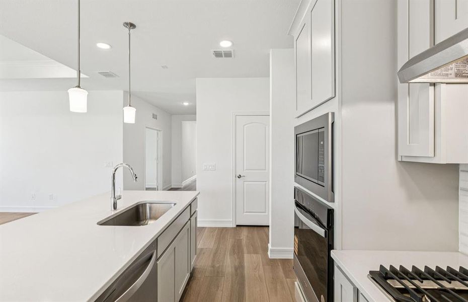 Spacious kitchen with eat-in bartop island Spacious kitchen with eat-in bartop island