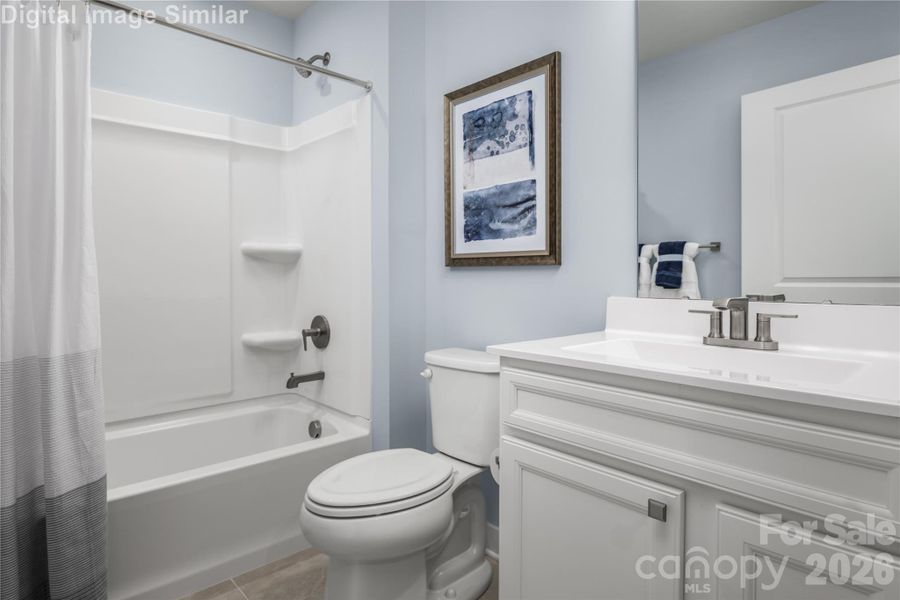 Bright, inviting shared bathroom with a tub perfect for winding down.
