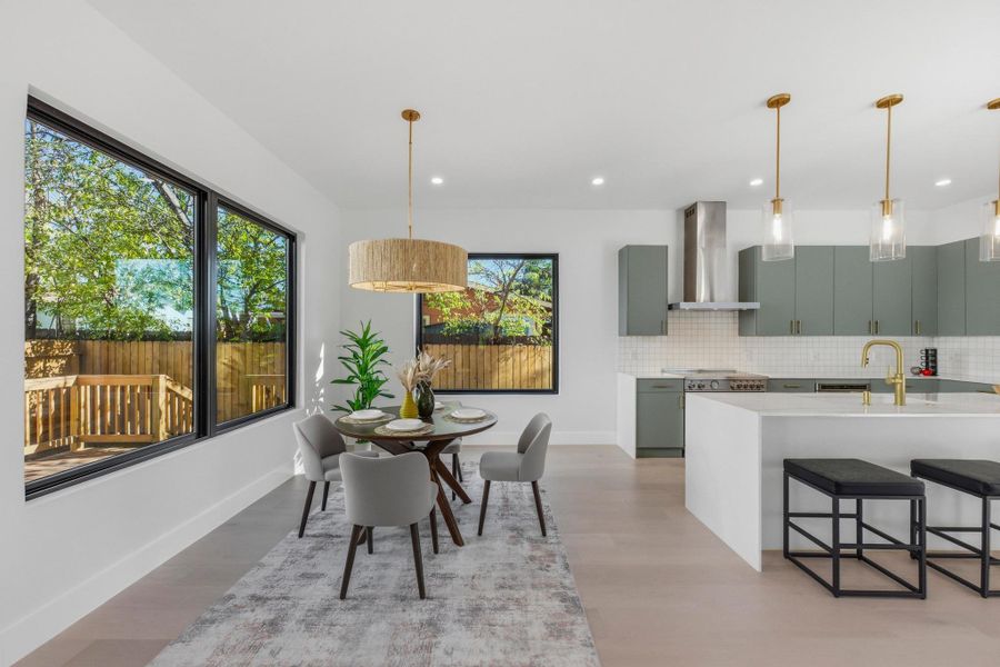 Dining space featuring light wood-style flooring and recessed lighting