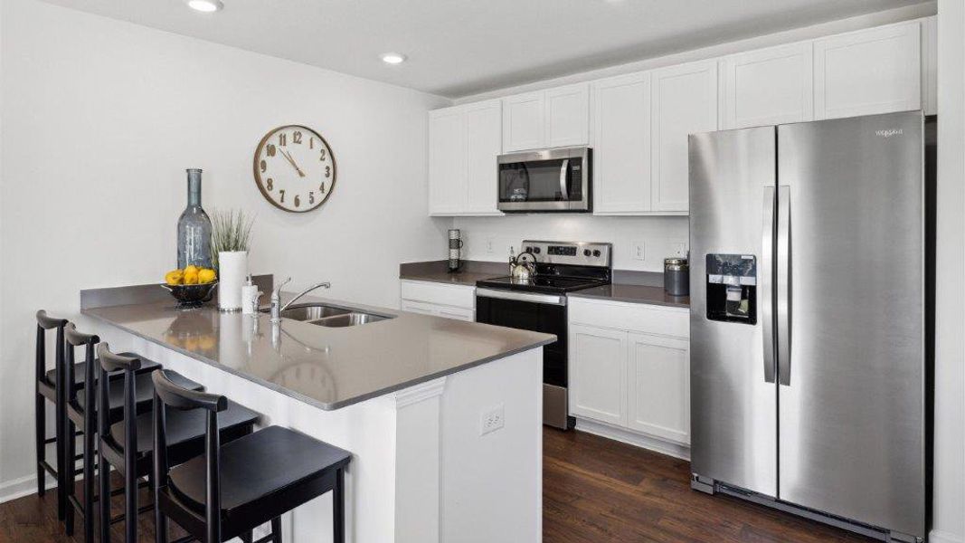 Representative furnished interior of a home built from the Altamont Townhome by D.R. Horton in Belcourt Landing, Cleveland (Image 8).