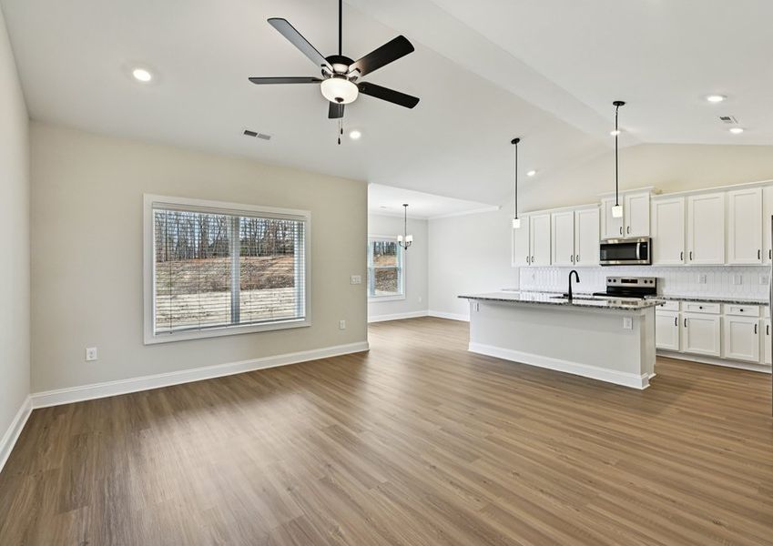 The living room, kitchen and dining room create the perfect space to host friends and family