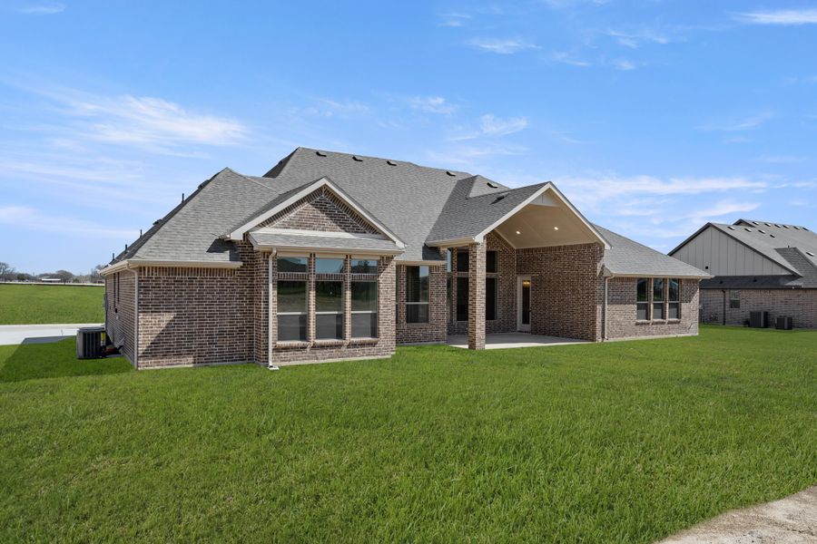 Exterior details and patio area of a home in Paloma Ranch, Justin (Image 20).