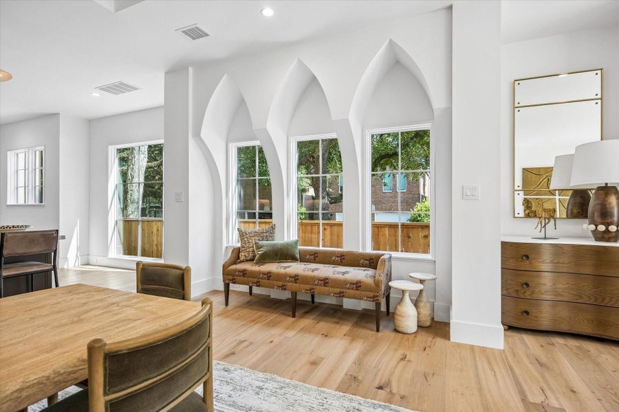 Charming vignette beneath the triplet of lancet style windows Charming vignette beneath the triplet of lancet style windows