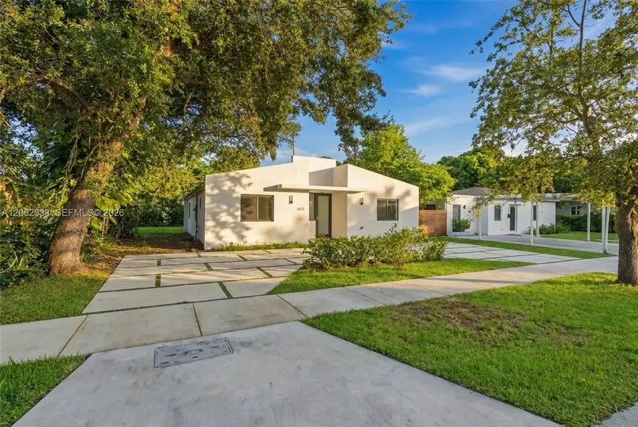 Front exterior of a new home in , South Miami, FL, highlighting curb appeal (Image 20). Front exterior of a new home in , South Miami, FL, highlighting curb appeal (Image 20).