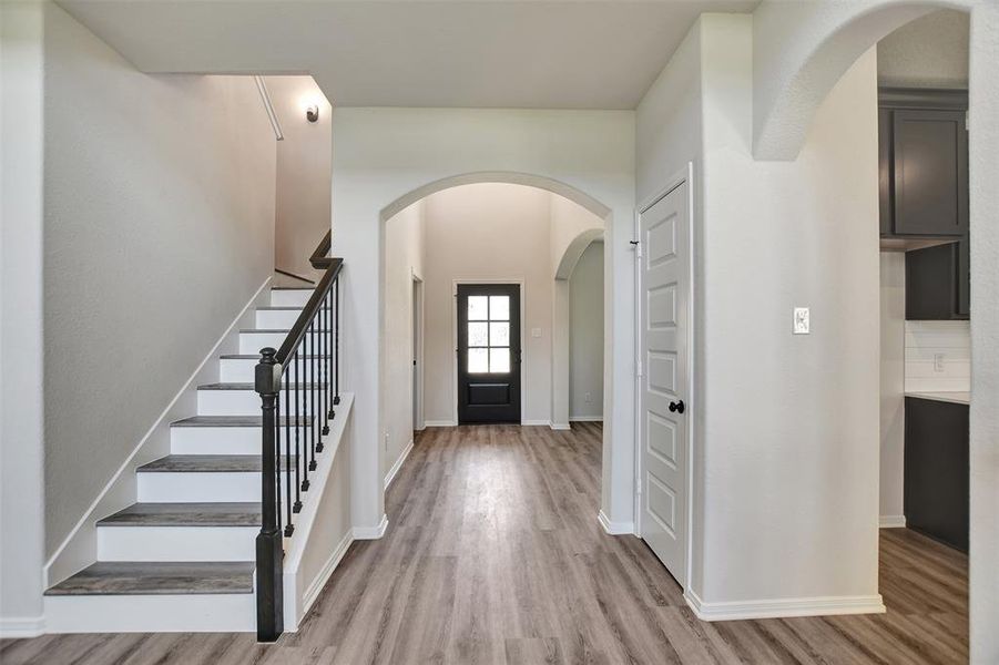 Luxury vinyl plank flooring throughout.