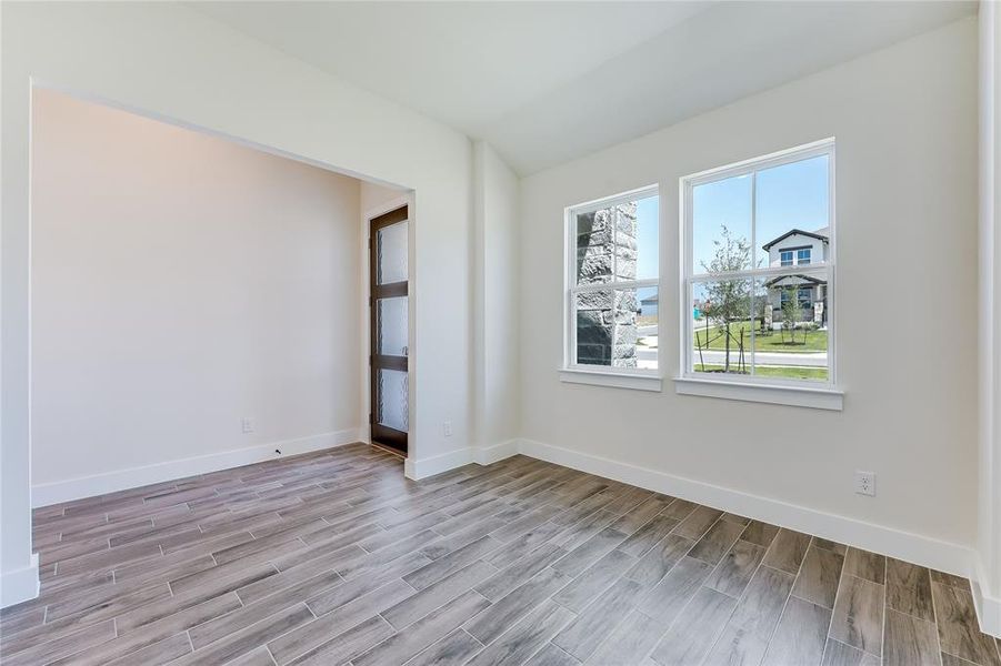 This is a SECOND flex room toward the front of the home- perfect for an office.