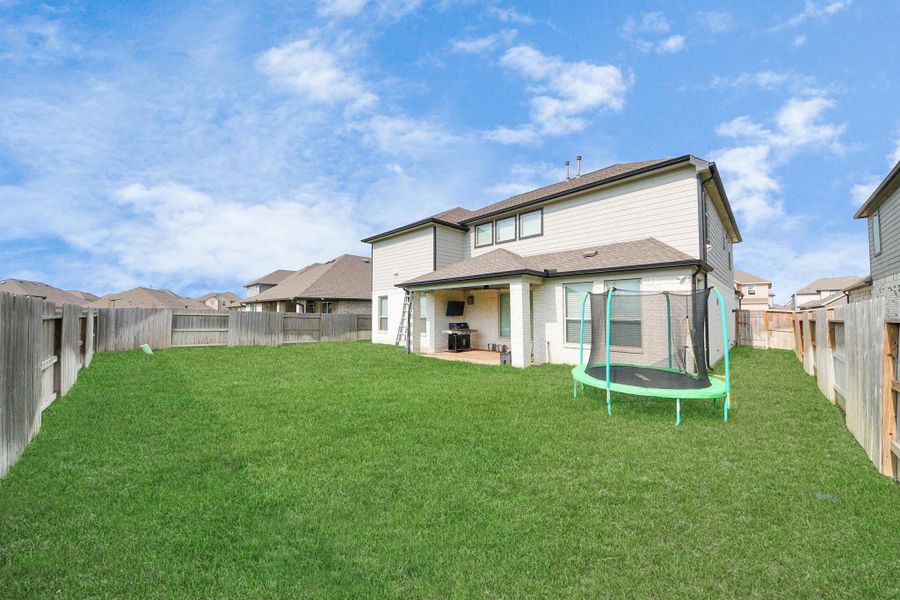 Front exterior of a new home in Sunterra, Katy, TX, highlighting curb appeal (Image 1). Front exterior of a new home in Sunterra, Katy, TX, highlighting curb appeal (Image 1).