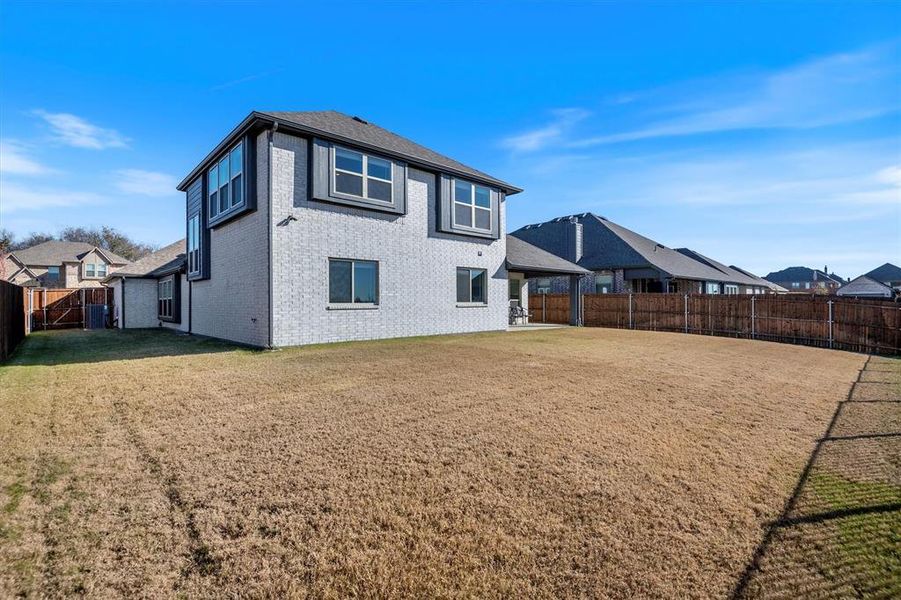 Exterior details and patio area of a home in The Grove, Midlothian (Image 4).