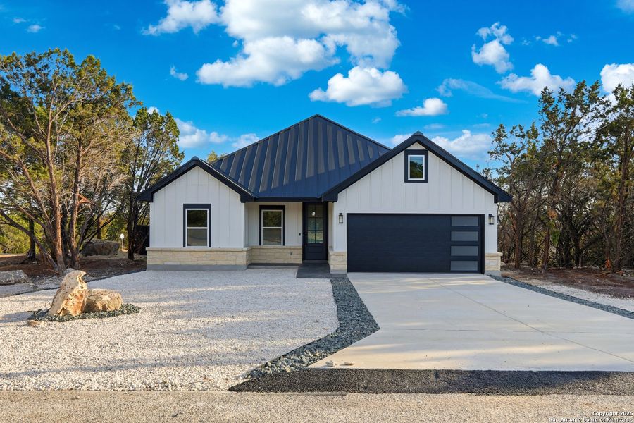 Front exterior of a new home in , Spring Branch, TX, highlighting curb appeal (Image 19). Front exterior of a new home in , Spring Branch, TX, highlighting curb appeal (Image 19).