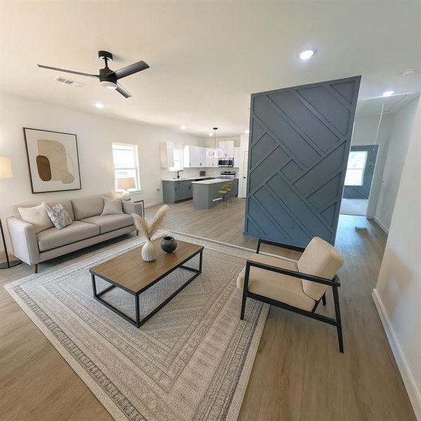 Living room with light wood-style floors, recessed lighting, and ceiling fan Living room with light wood-style floors, recessed lighting, and ceiling fan