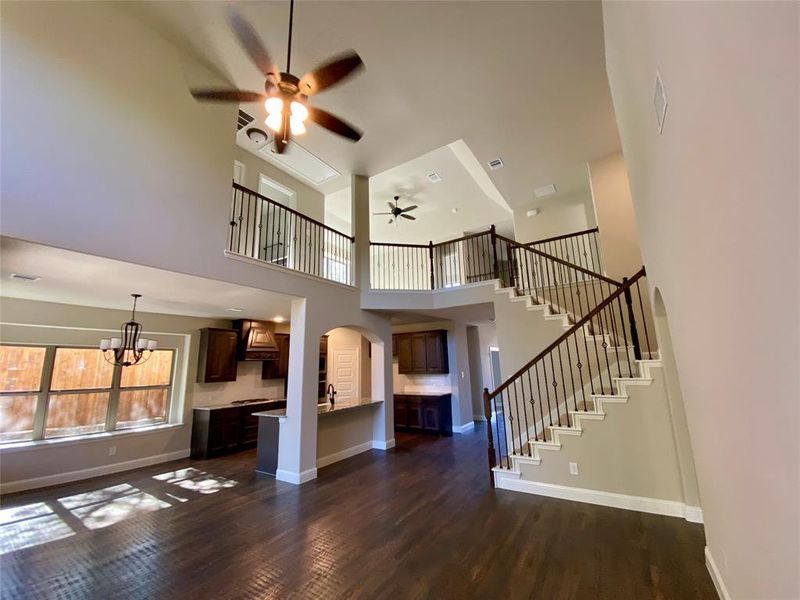 Impressive family room with wrought iron spindles on staircase